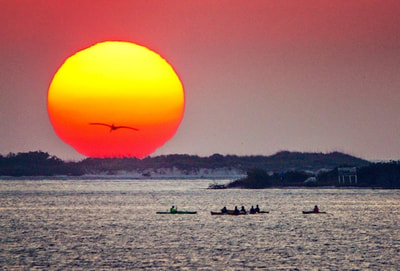 sunset coastal kayaking